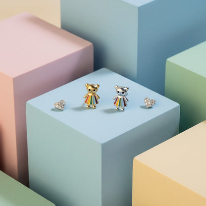 Pair of bear-shaped earrings on a colorful geometric background