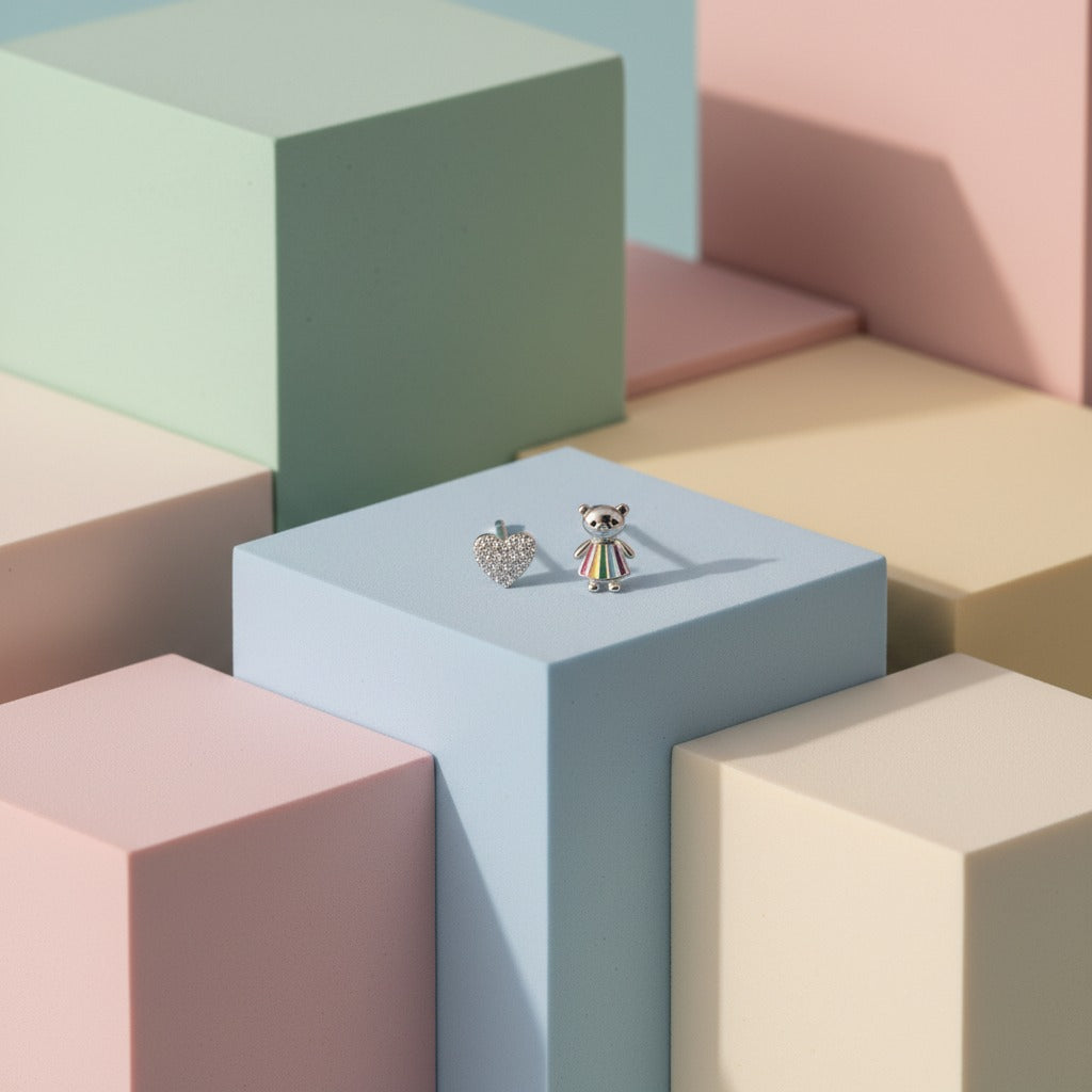 Two earrings on a pastel-colored geometric cube arrangement